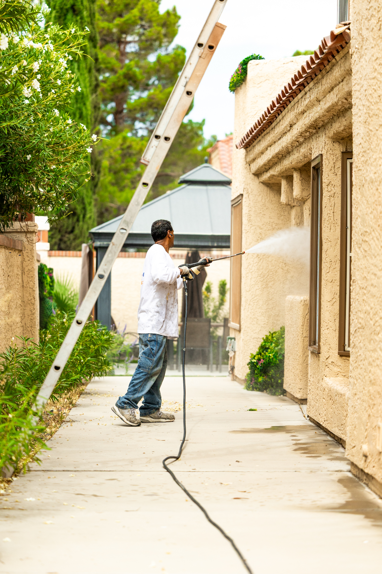Base coat applied to prepared exterior wall surfaces on a Las Vegas home